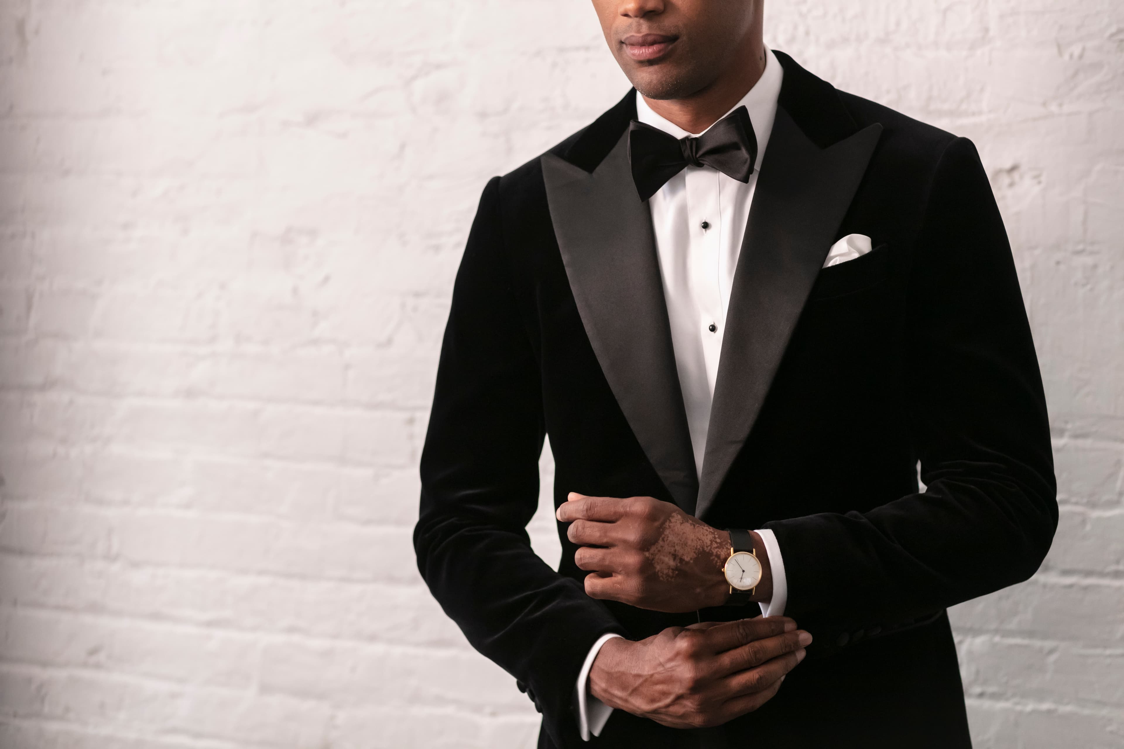 Groom in a black velvet tuxedo